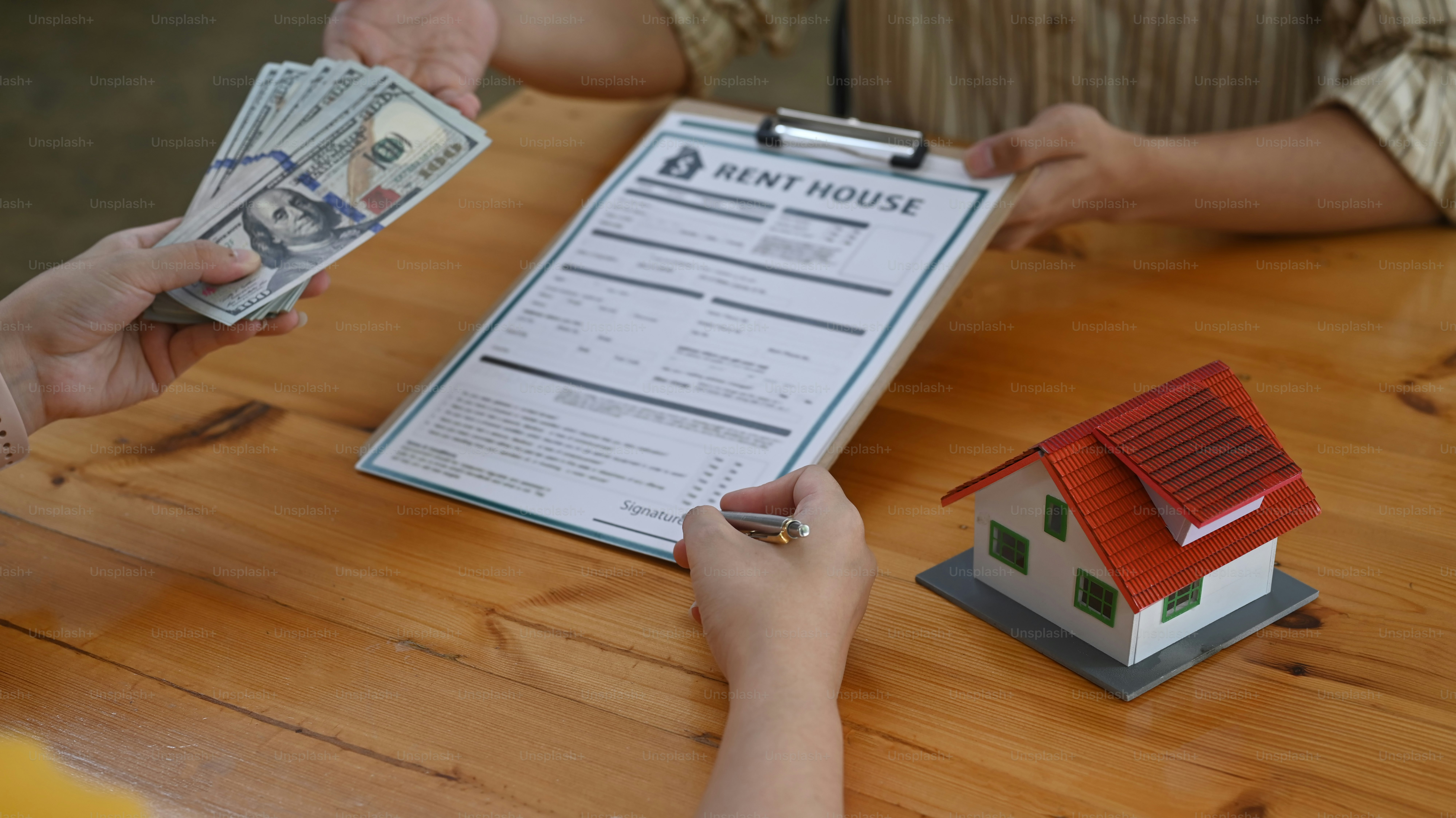 Buyer is signing a purchase agreement from broker.\